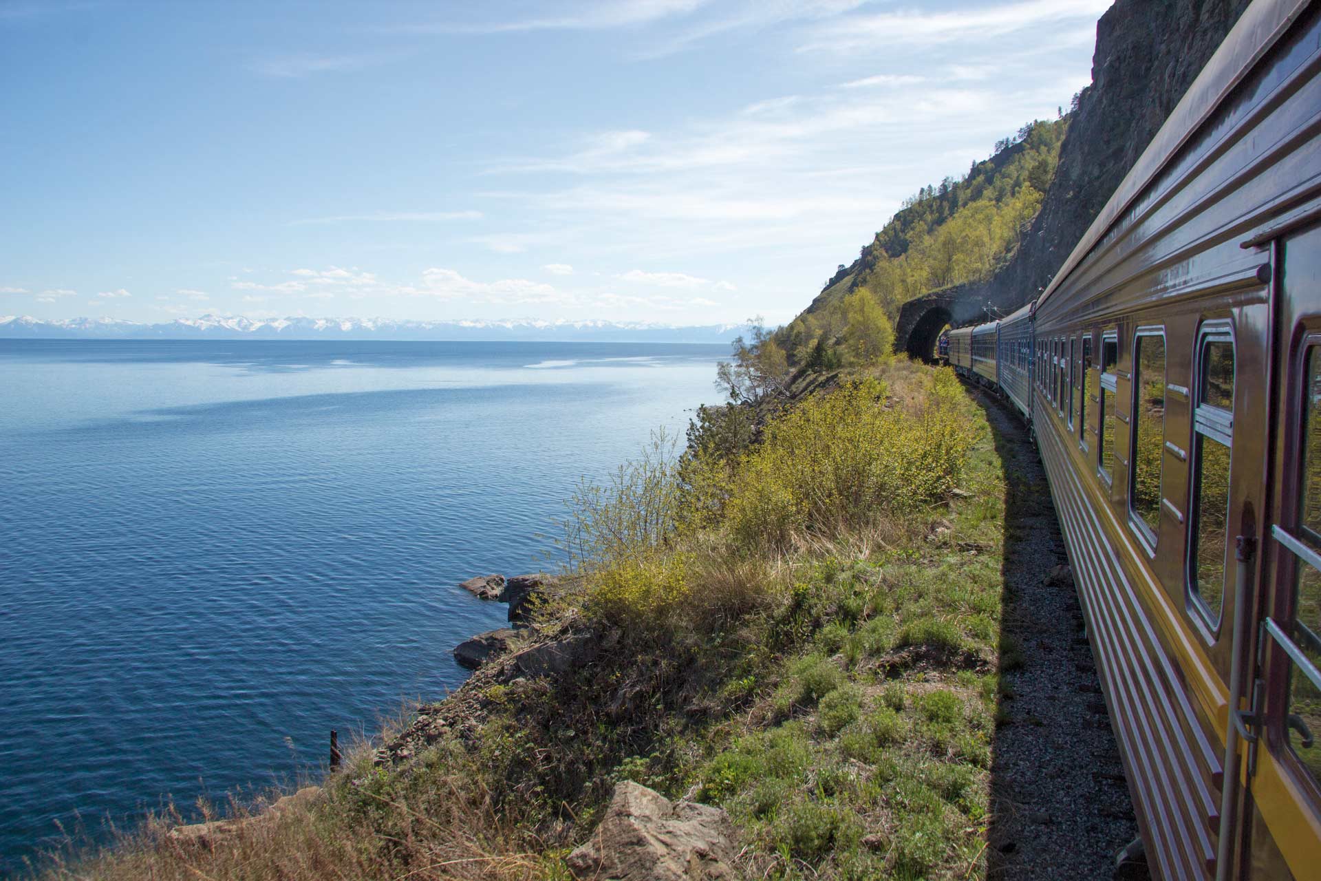 Trans-Siberian Railway, coast of Lake Baikal. Train movement along the lake shore